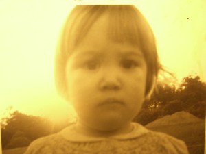 My little sister in 1969.  I was too trapped in the stare-down to get a picture of the grandbabe.