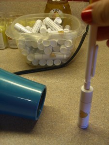 Tip: hold tube in place with a pencil eraser.  The tube won't blow across the kitchen and you won't burn your finger.